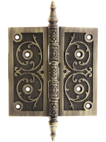 5 inch Solid Brass Steeple Tip Hinge With Decorative Vine Pattern in Antique Brass.